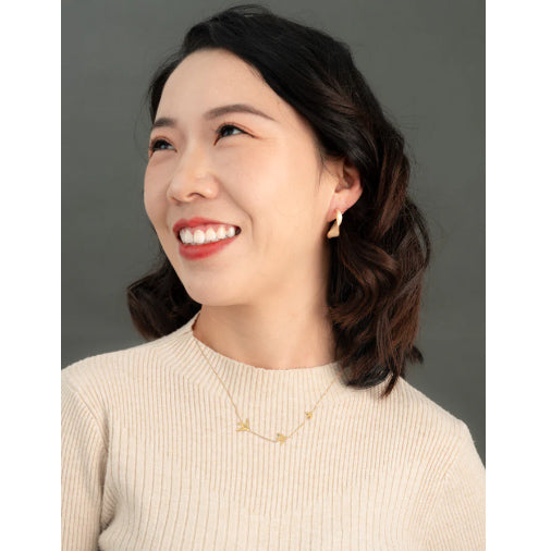 With a Twist Hoops in Soft Coral